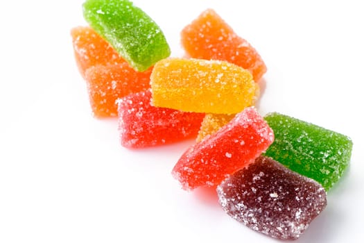 Sweet delicious multi-colored marmalade or jelly candies assorted in sugar sprinkles with fruit and berry flavor on a white background. 1