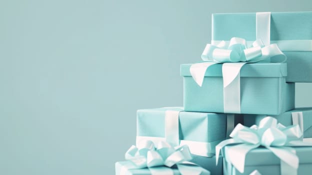 Stack of blue gift boxes with bows and ribbons perfect for celebrations and special occasions