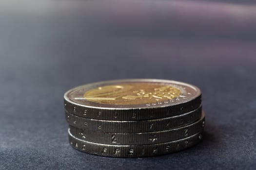 Euro close up photos. Macro coins. Soft focus, dark background