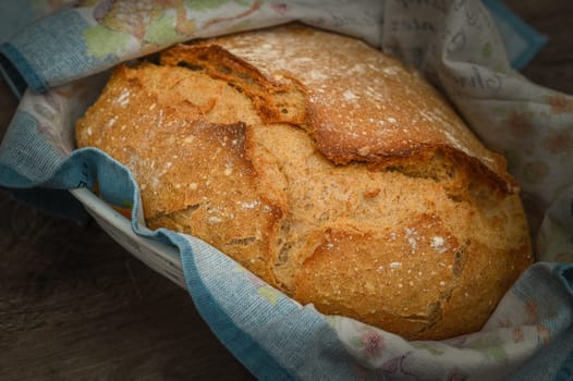 Homemade artisan bread on white wood rustic dinner table 2