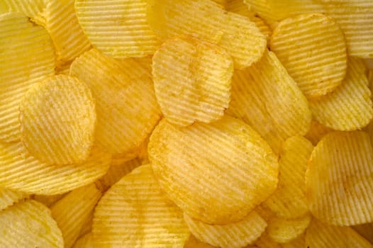 Full frame foodbackground of potato chips, top view