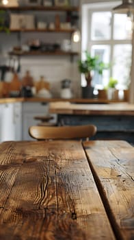 A hardwood table is featured in the foreground with a view of a kitchen in the background. The wooden flooring and a potted plant add warmth to the interior design