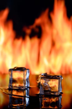 fire and ice cubes on a black background, place under the text 8