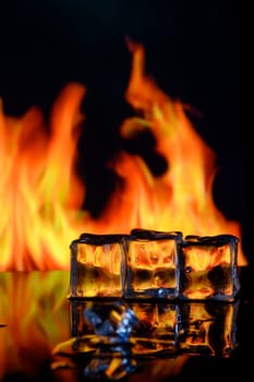 fire and ice cubes on a black background, place under the text 5