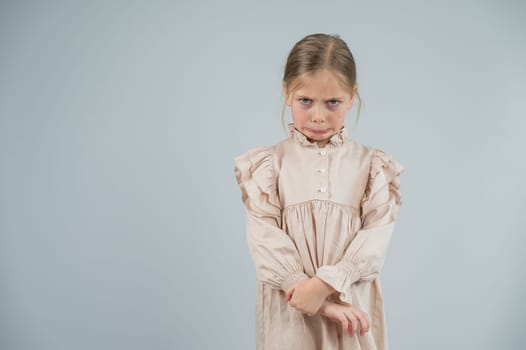 Portrait of a dissatisfied Caucasian girl on a white background