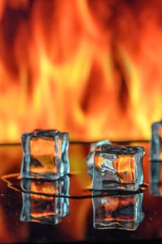 cubes of ice and fire on a water surface on an abstract background 3