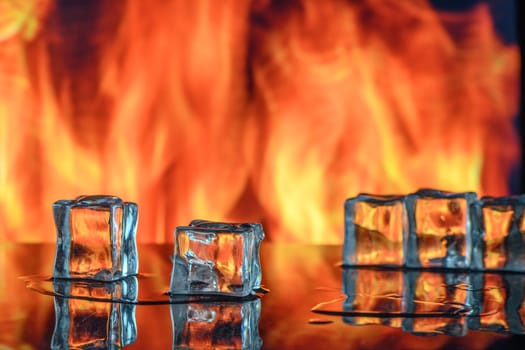 cubes of ice and fire on a water surface on an abstract background 1