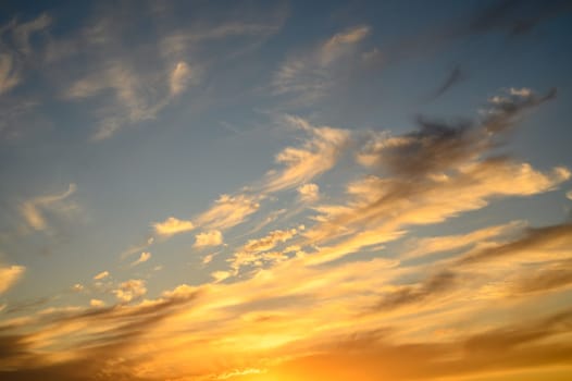 Colourful sunset sky. Full frame view of wispy colourful clouds up in the sky during sunrise or sunset hour 2