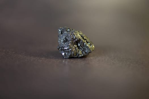 Pyrite. Pyrite is a metal that is similar to gold. High quality photo. On a black background