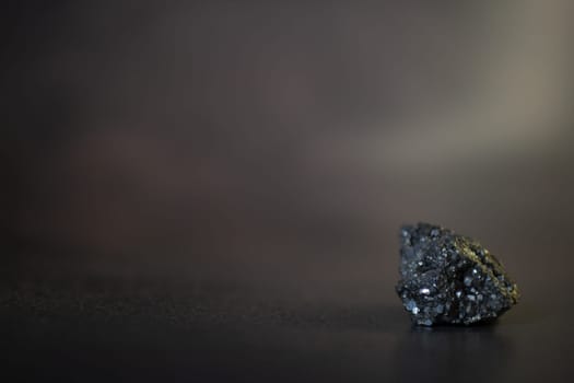 Pyrite. Pyrite is a metal that is similar to gold. High quality photo. On a black background
