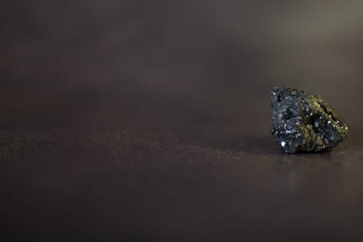 Pyrite. Pyrite is a metal that is similar to gold. High quality photo. On a black background