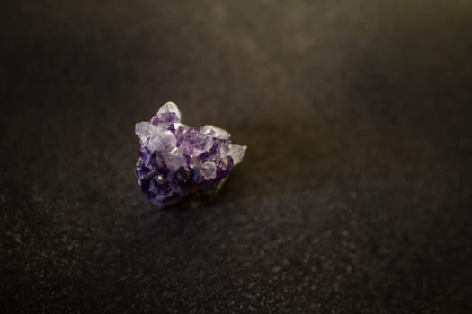 Violet amethyst quartz crystals on black background. High quality photo