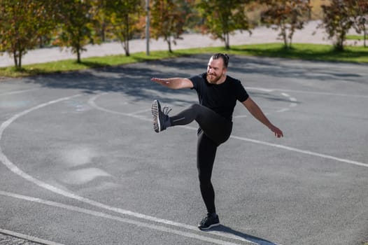 Bearded man doing exercises outdoors