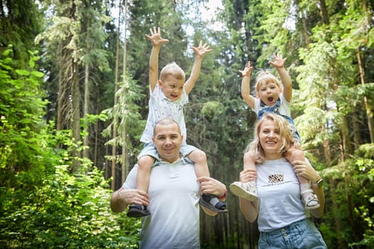 Family playing in the forest