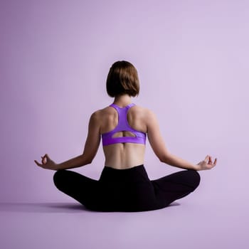 Full body length back rear view gaiety shot athletic and sporty woman doing healthy and meditative yoga exercise workout posture on isolated background. Healthy active and body care lifestyle