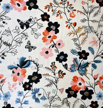 Colorful butterflies and flowers on white fabric with black, blue, and pink flowers, nature inspired beauty and artistic design