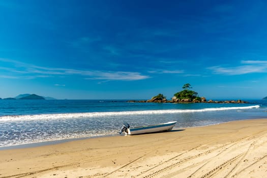 Speedboat on the sand of remote Castelhanos beach on the island of Ilhabela