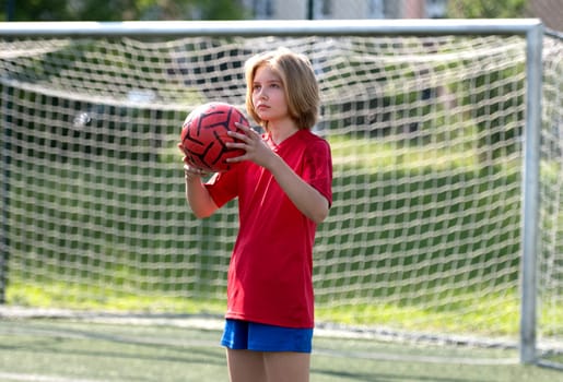 Girl Goalkeeper Stands At Goalposts During Children'S Football Match