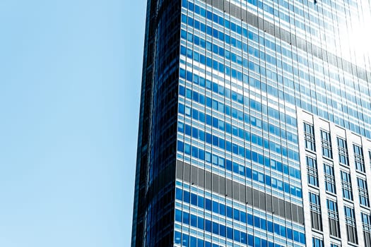 Business, city lifestyle and futuristic design concept - Contemporary office building in financial district, modern urban architecture