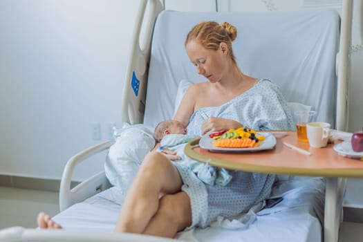 A woman breastfeeds her baby in the hospital while simultaneously having lunch herself. This moment of multitasking illustrates the balance between motherhood and self-care, emphasizing maternal dedication and the nurturing atmosphere of the hospital ward.
