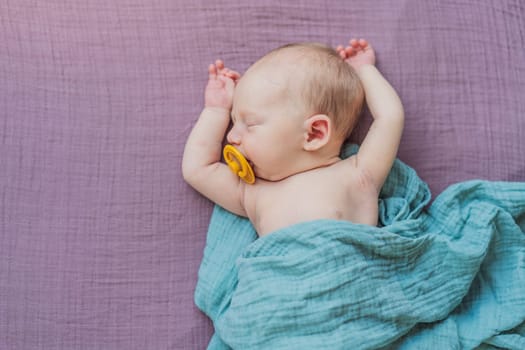 The baby is sleeping peacefully in his cozy nest. Newborn photo session captures the serene innocence and warmth of early moments.