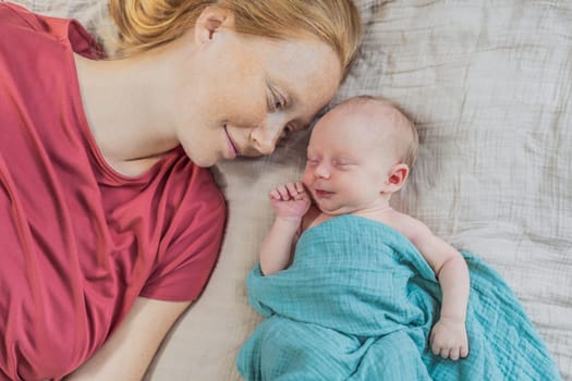 Mom with newborn baby relaxing on the sofa at home. This tender moment highlights the bond between mother and child in a comfortable and loving family environment.