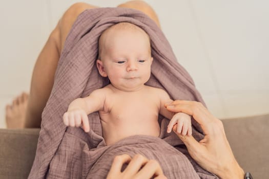 Dad and newborn at home. This tender moment captures the bond between father and child in a loving and comfortable family environment highlighting the joys of parenthood and the warmth of home.