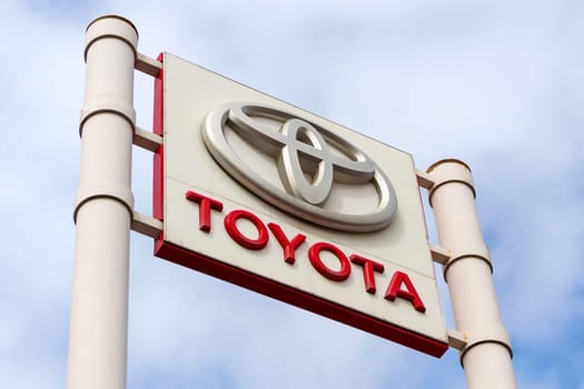 Tyumen, Russia-March 02, 2024: Toyota logo Sign Against Blue Sky. Selective focus