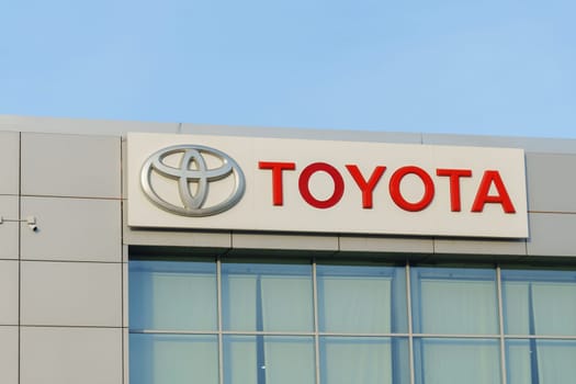 Tyumen, Russia-March 18, 2024: Toyota sign standing prominently against a clear blue sky, showcasing the iconic brand logo