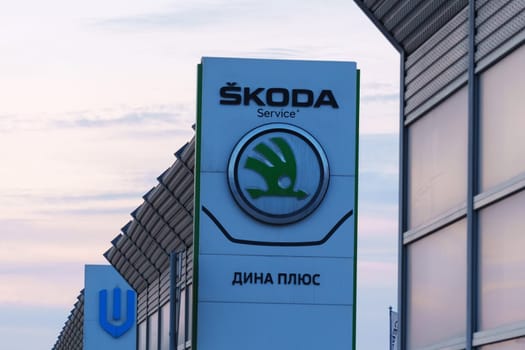 Tyumen, Russia-March 18, 2024: Skoda logo car advertisement on its side, showcasing the brands logo and vehicle model.