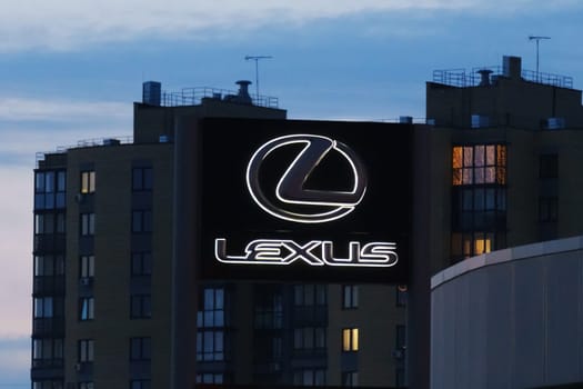 Tyumen, Russia-March 18, 2024: Sign displaying the Lexus logo on the side of a building, indicating a dealership or service center for the luxury car brand.