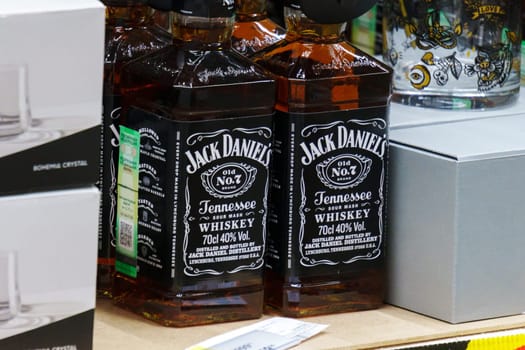 Tyumen, Russia-March 18, 2024: Assorted Bourbon Jim Beam Bottles Displayed on Shelf