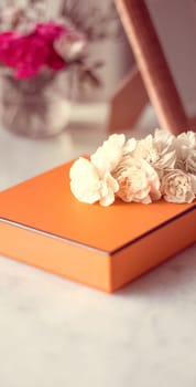 Present box and flowers for her - Mother's day ideas, happy giving and holiday inspiration concept. The perfect gift for mom