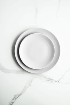 White empty plate on marble, flatlay - stylish tableware, romantic table decor and food menu concept. Serve the perfect dish