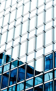 Business, city lifestyle and futuristic design concept - Contemporary office building in financial district, modern urban architecture