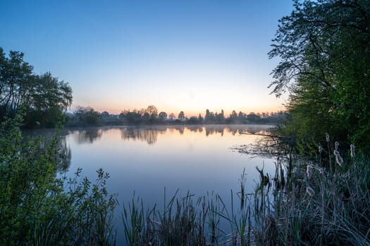 Panoramic image of nature reservat Thuerer meadows close to Mendig during sunrise, Eifel, Rhineland-Palatinate, Germany