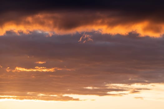 Low angle view to evening sky with dramatic clouds