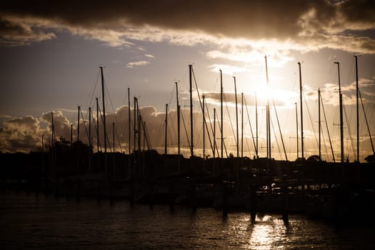 Hobsons Bay around Ferguson St Pier in Williamstown waterfront at dusk in winter in Victoria, Australia