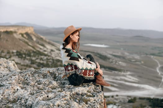 Serene woman enjoying the scenic view of the majestic mountains at yellowstone national park