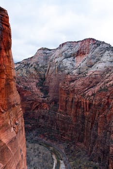 Breathtaking view of the iconic sandstone cliffs from the West Rim Trail in Zion National Park, Utah. The park road winds along the canyon below in winter - Utah, USA