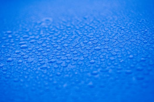 Water droplets on blue cover background. Water droplets concept.