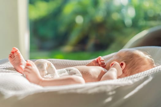Baby basks in the sun, absorbing vitamin D. This sunny moment highlights the importance of natural light for the baby's health and development, promoting overall well-being and joy.
