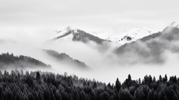 A serene landscape showcasing mist enveloping the snow-capped peaks and dense forests, captured in black and white