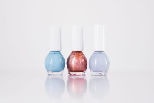 Beauty, make-up and cosmetics concept - Nail polish bottles, manicure and pedicure collection