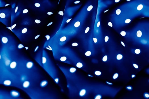 Fashion design, interior decor and vintage material concept - Classic polka dot textile background texture, white dots on blue luxury fabric design pattern