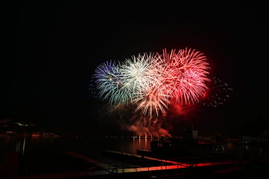 Beautiful colorful fireworks with reflections in water. Brno dam, the city of Brno-Europe. International Fireworks Competition.