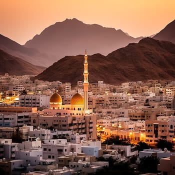 A beautiful city with a large mosque in the background. The water is calm and the sky is orange