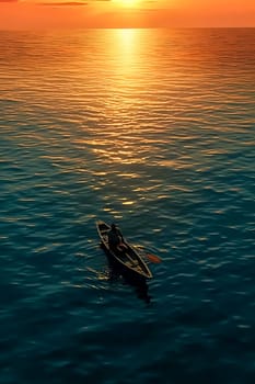 A man is in a canoe on a lake at sunset. The sky is orange and the water is calm