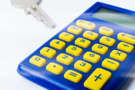 The calculator and a home key macro closeup, white background