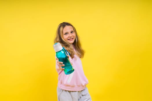 Girl teen hold water bottle. Health and a water balance. Drink and beverage concept.